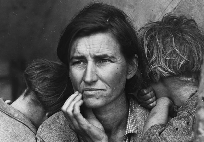 black and white photo of a woman and two children